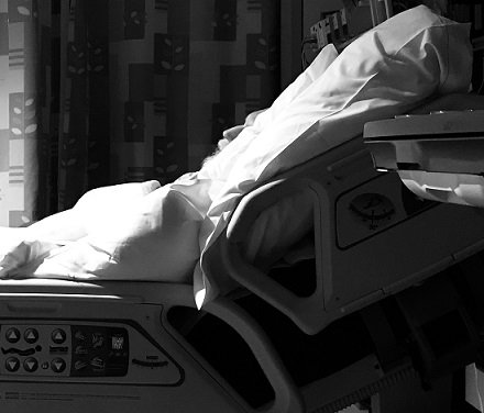 Man lies in hospital bed