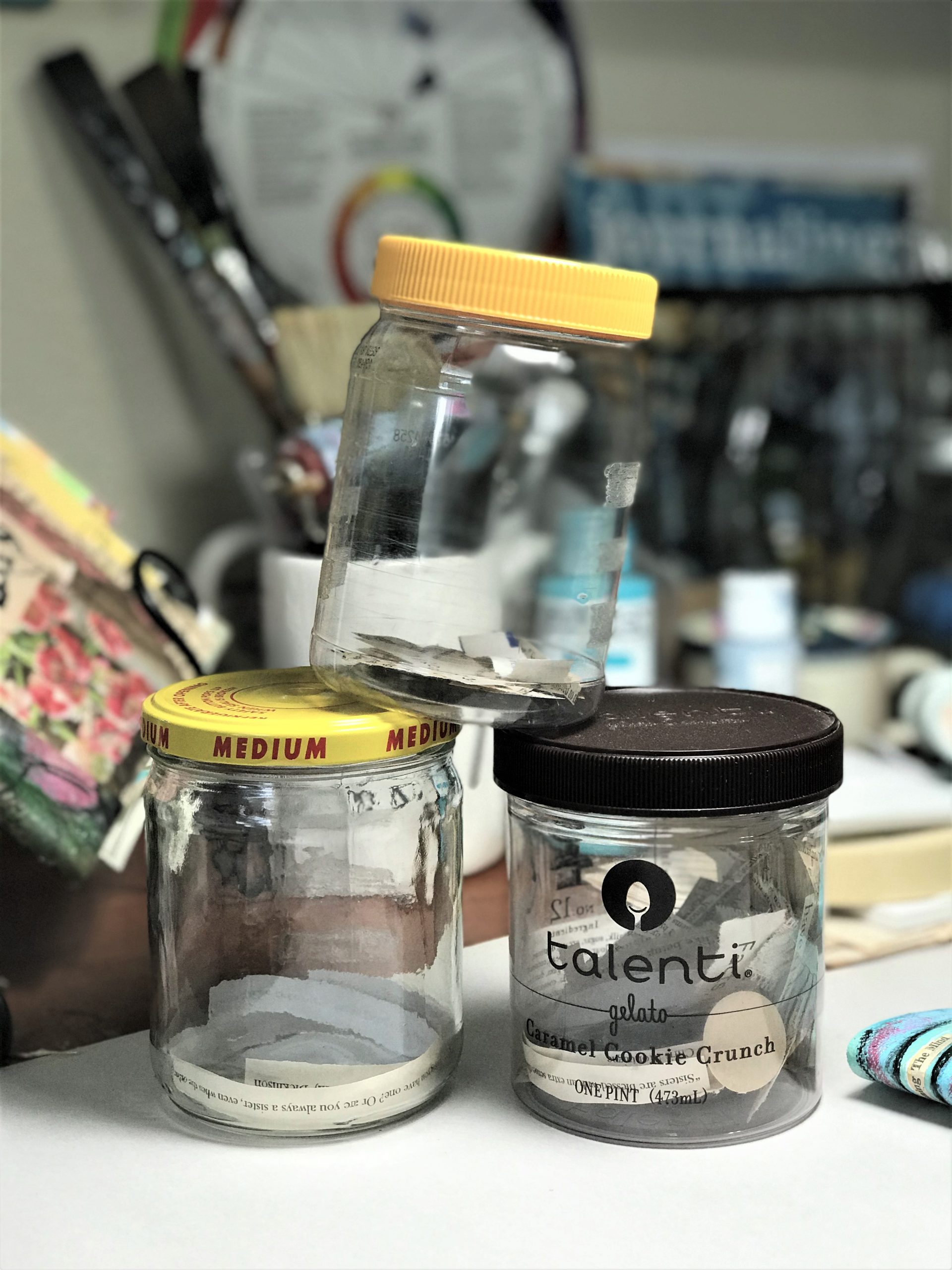 words and word phrases in jars on an art table
