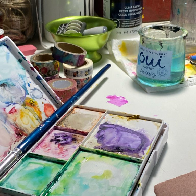 watercolors on an art table